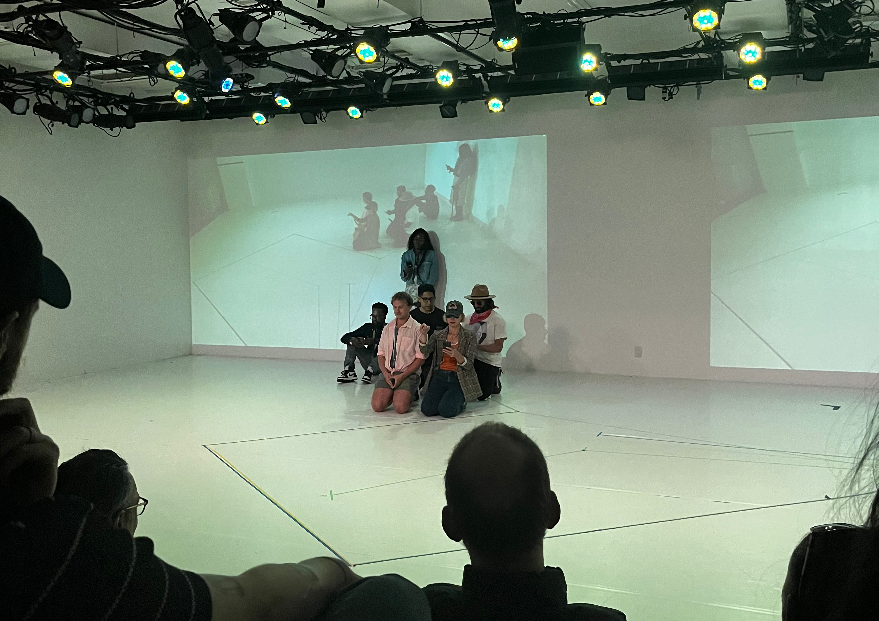 Performers called to the stage by the AI director for the first scene.